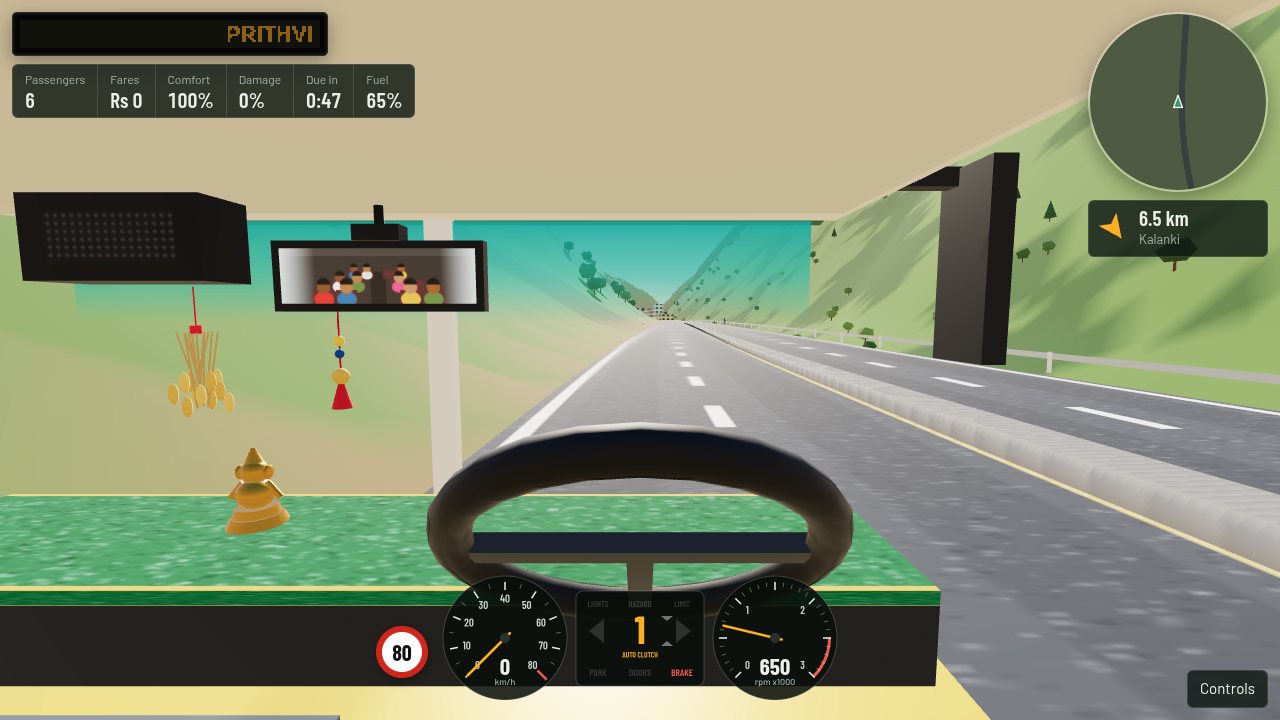 Inside the Tata bus cab: green felt on the dash, a golden idol, a swinging mirror trinket, dried paddy under the route box and the passengers in the wide mirror